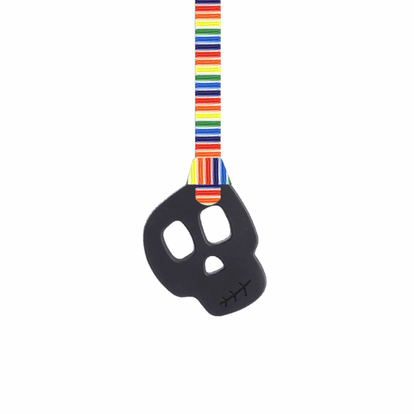 Black skull chew necklace on retro stripes leaves lanyard