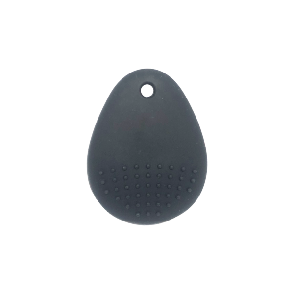 The reverse side of a black chewable dragon pendant