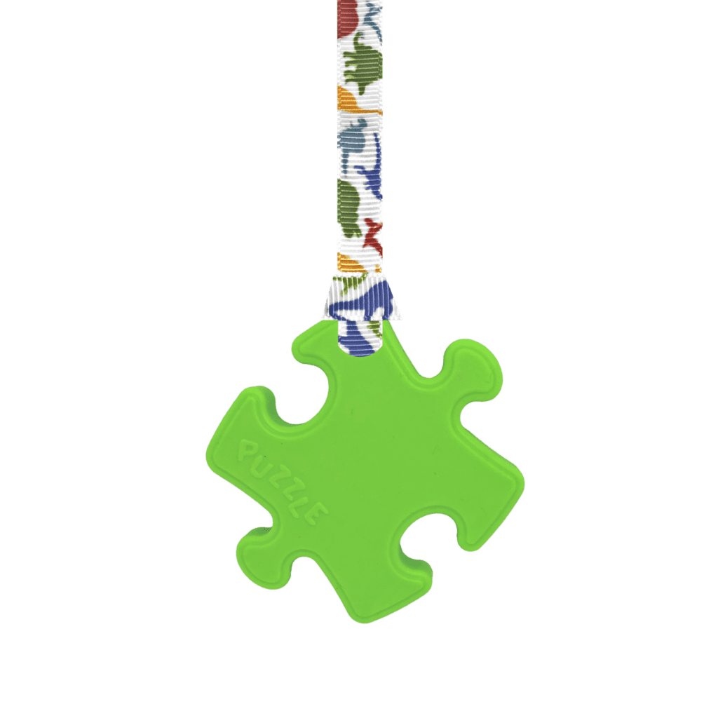 Green Puzzle chew necklace with dinosaurs lanyard