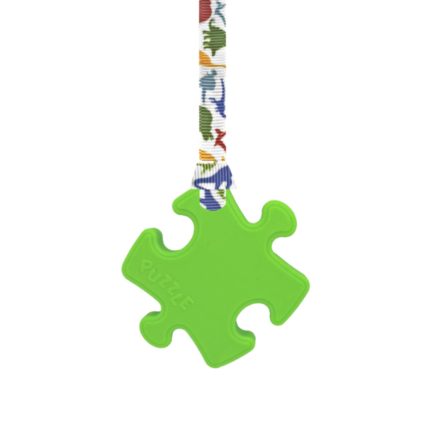Green Puzzle chew necklace with dinosaurs lanyard