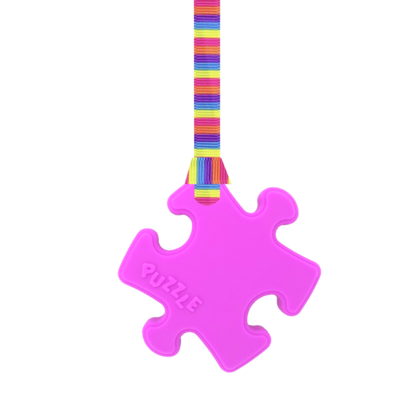 Magenta Puzzle autism chew necklace with pink stripes lanyard