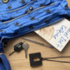 Black square chew necklace with handbag and contents