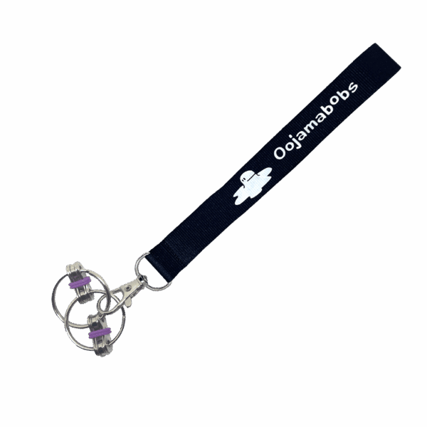 Standard Fidgi-Flip fidget toy on wrist lanyard
