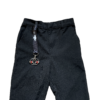 Standard Fidgi-Flip fidget toy on wrist lanyard on school trousers