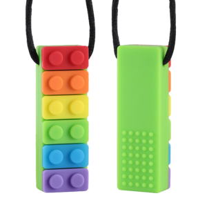 Front and reverse face of a Rainbow brick chew necklace in green on black cord