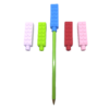 5 chewy brick pencil toppers in red, blue, pink, purple and green, one is on a pencil