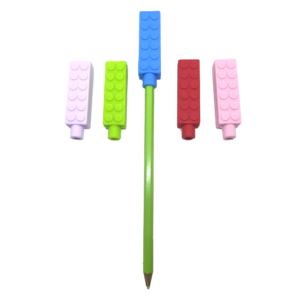 5 chewy brick pencil toppers in red, blue, pink, purple and green, one is on a pencil