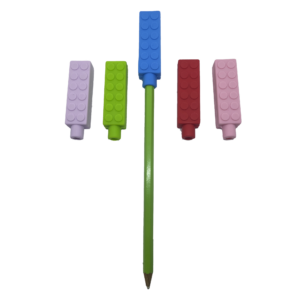 5 chewy brick pencil toppers in red, blue, pink, purple and green, one is on a pencil