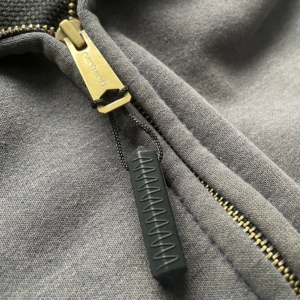Black Zip Chew attached to zip up grey hoodie