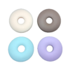 Reverse face of doughnut chew necklace in 4 colours