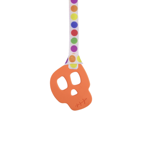 Orange skull chew necklace on rainbow dots lanyard