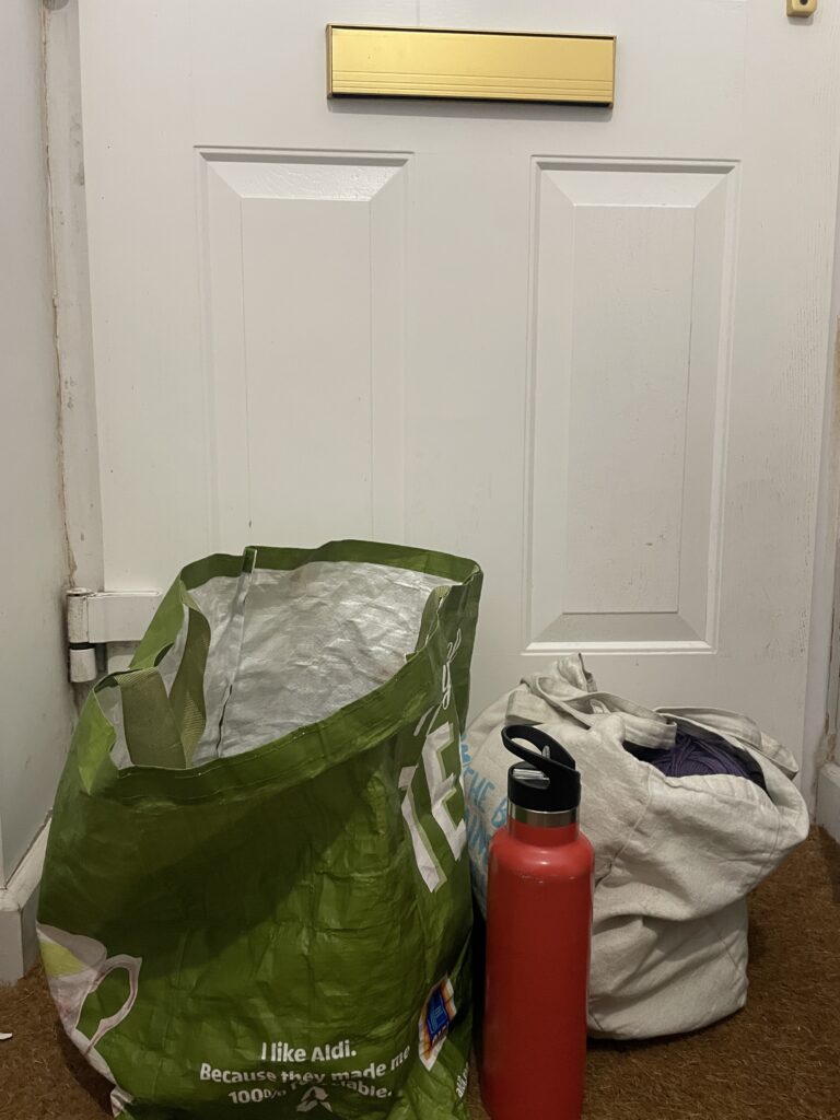 bags by a white door