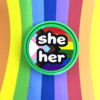 Pronoun pop badge with Pride flag backgrounds – she/her – from Sensory Oojamabobs on a rainbow striped background.